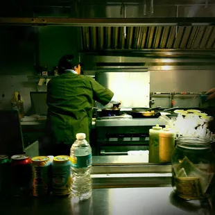 a chef preparing food in a commercial kitchen
