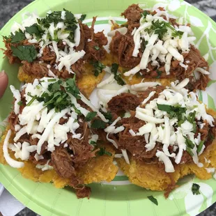 Tostones topped with ropa vieja