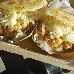 Venezuelan arepas stuffed with pulled chicken, mixed cheese &amp; topped with garlic &amp; cilantro sauce! Heaven on earth!
