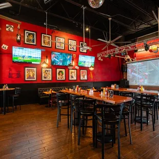 a restaurant with a red wall