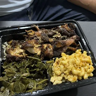 Jerk Chicken Meal with collard greens Mac and cheese