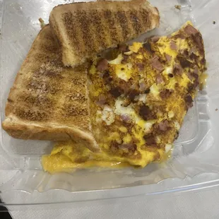 Ham and cheese omelette , white toast