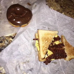 a sandwich and a chocolate donut