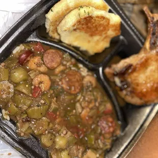 Shrimp and okra over rice.... The pork chop was no so good; but the biscuits and the stew, please believe me!