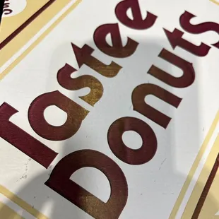 a sign for a donut shop