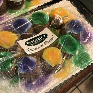 a variety of mardi gras donuts
