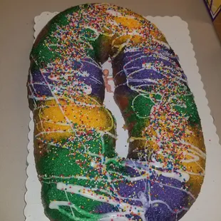 a mardi gras donut with sprinkles