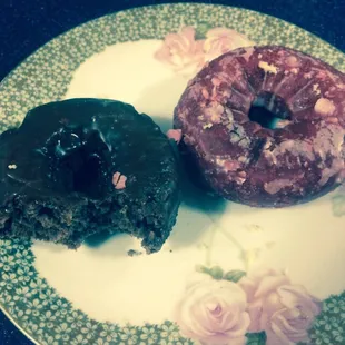 Chocolate doughnut and red velvet doughnuts - edible, but a couple days old