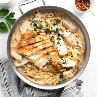 a pan filled with chicken and noodles