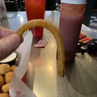 a hand holding a piece of food