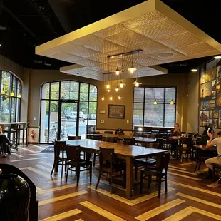 a dining area with tables and chairs