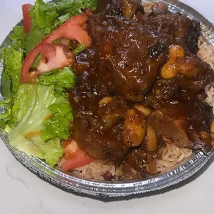 Oxtails rice and peas with fresh lettuce and tomatoes