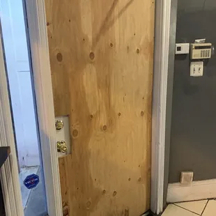 a bathroom with a wooden door