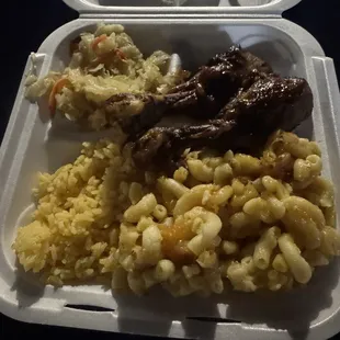 Chicken combo with their macnocheese, rice and cabbage.