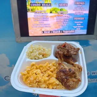 a tray of food with macaroni and cheese