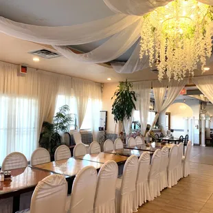 a dining room with a chandelier