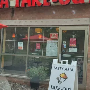 a tasty asia take - out sign