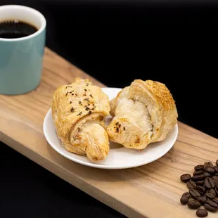 a plate of pastries and a cup of coffee