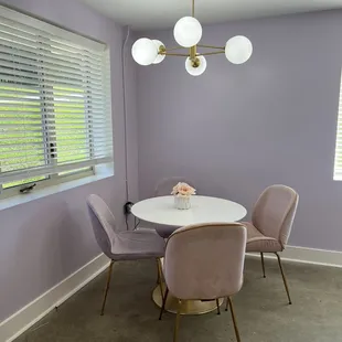 a dining room with purple walls