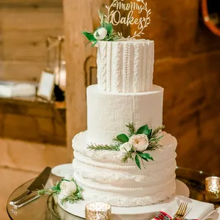 a wedding cake on a barrel