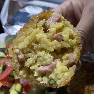 Arancini balls filled with rice, lots of ham, and blended with lots of cheese!