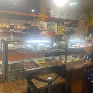 a woman standing in front of the counter