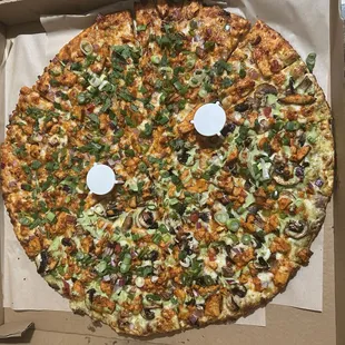 Left/top side Butter Chicken Curry Pizza Right/Bottom Desi Chicken Pizza