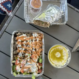 Combo over rice, chicken shawarma sandwich and hummus
