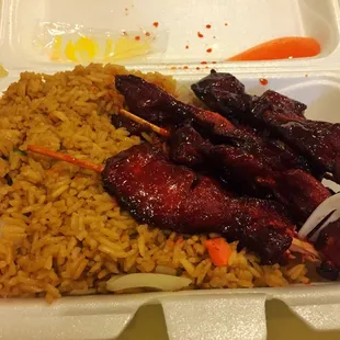 Chicken on a stick with fried rice