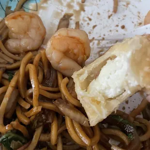 a plate of noodles and shrimp