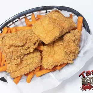 a basket of fried chicken and french fries