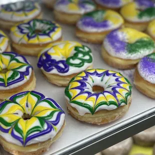 a variety of mardi gras donuts