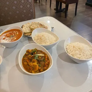 Mixed Veggie Curry and Tomato and cream Paneer with a side of potato and pea naan.