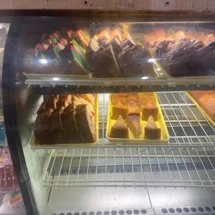 a variety of baked goods in a display case