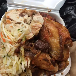 Baked chicken with rice and peas, salad and oxtail gravy.