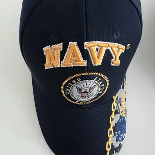 a navy cap with a chain on it