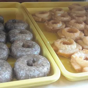 two trays of doughnuts