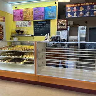 a counter with a variety of donuts