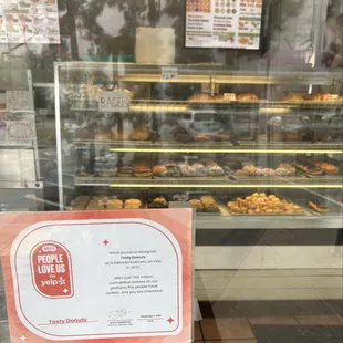 a sign in front of a bakery