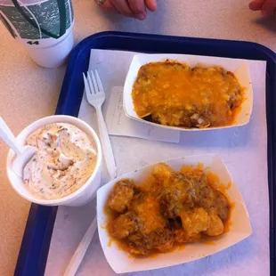 a tray of food and a cup of coffee