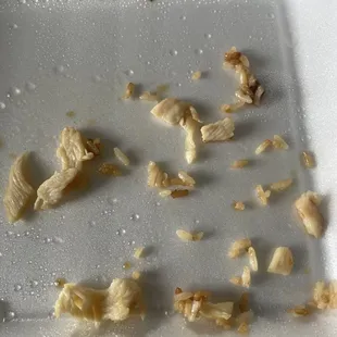 I believe it's pieces of chicken (deli chicken) in the fried rice