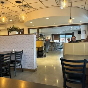 a restaurant with tables and chairs