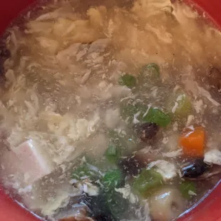 Egg flour soup , it egg , tofu , mushrooms, carrots spring onions , and peas .  Also half the portion they give you in this picture.