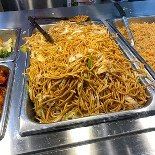 a variety of food in a buffet