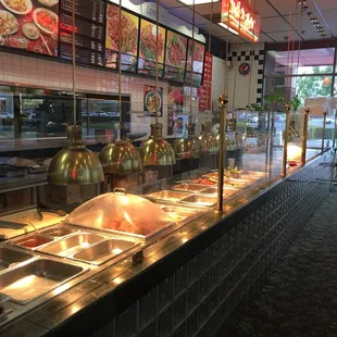 a buffet area with a variety of food items