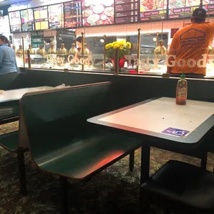 a restaurant with tables and booths