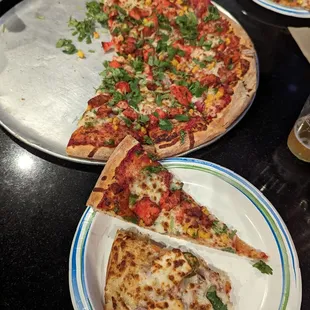 Tandoori Chicken pizza and a partial slice of Paneer pizza.  So good!!