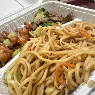 Two item combo plate with broccoli beef, orange, chicken, and chow mein. (angled so you can get an idea of the portion, this is half eaten).