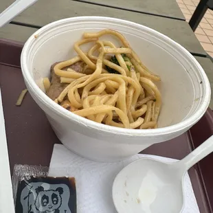 Some of the noodles put into a small cup to share with son.