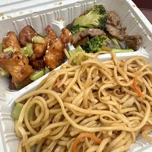 Two item combo plate with broccoli beef, orange, chicken, and chow mein.